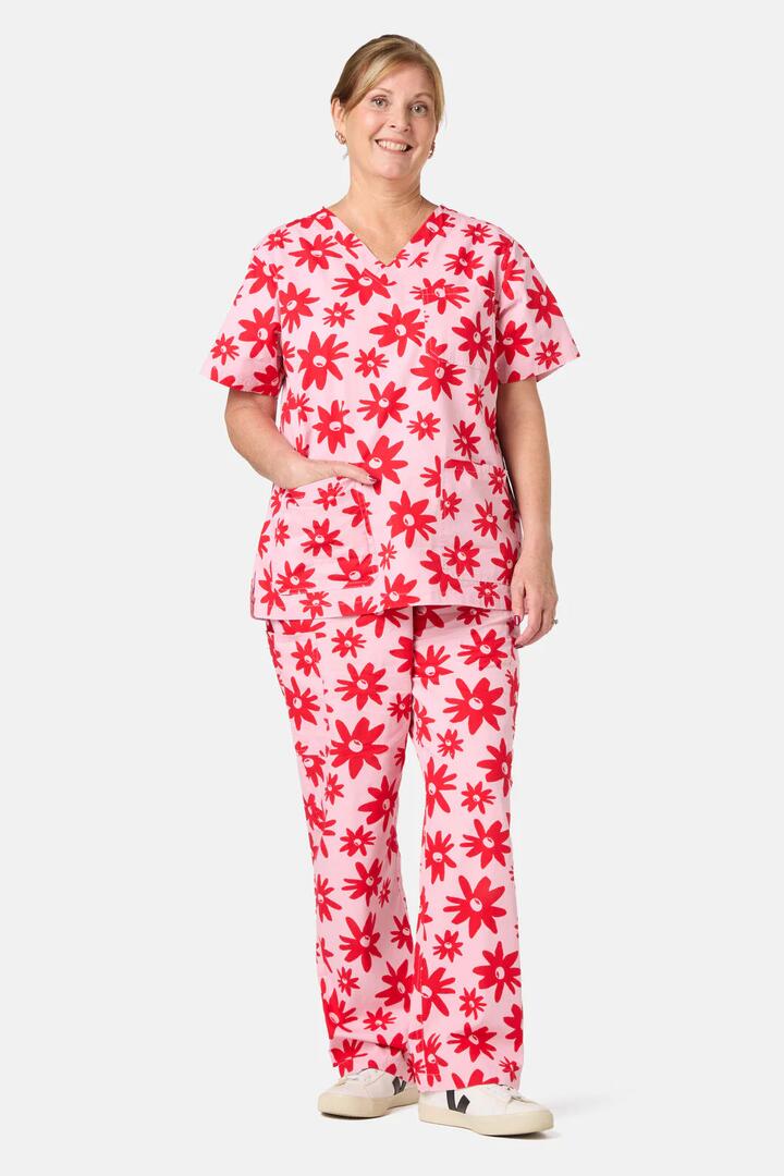 Image of a model wearing Uniforms & Workwear. Product name - Gidgets Scrub Set in Pink colour by brand - Gorman