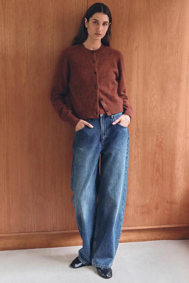 Image of a model wearing Outerwear. Product name - Carina Burnt Amber Merino Wool Cardigan in Orange colour by brand - Assembly Label