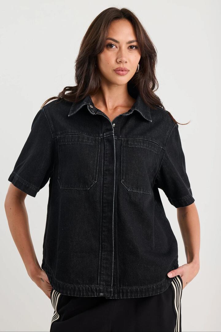 Image of Coats & Jackets. Product name - Crucial Black Denim Short Sleeve Shacket in Black colour by brand - Stories be Told