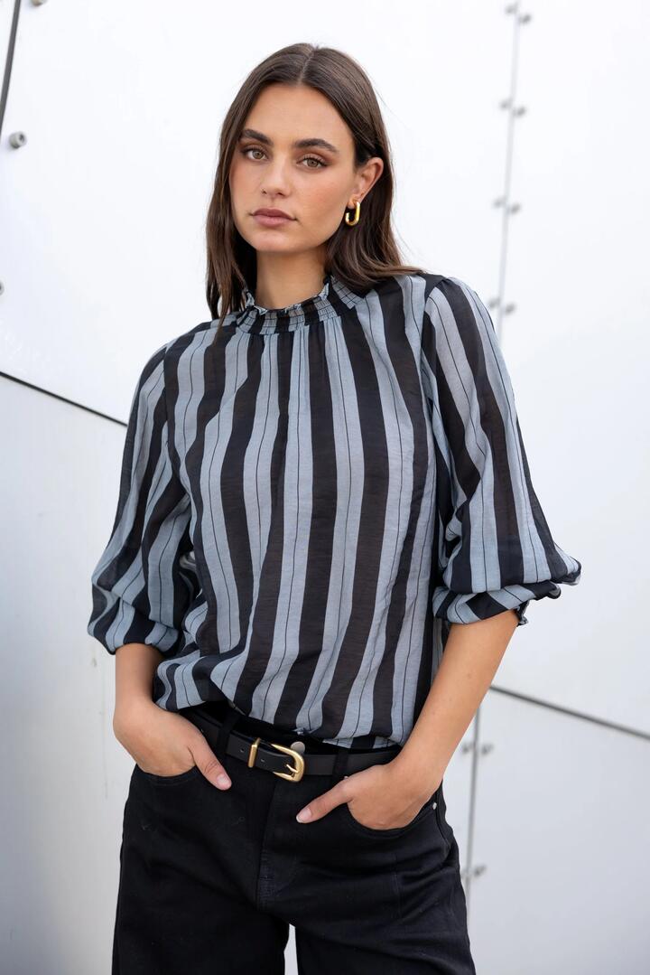 Image of a model wearing Tops. Product name - Embrace Grey Stripe Shirred Neck LS Top in Grey Stripe colour by brand - Among the Brave