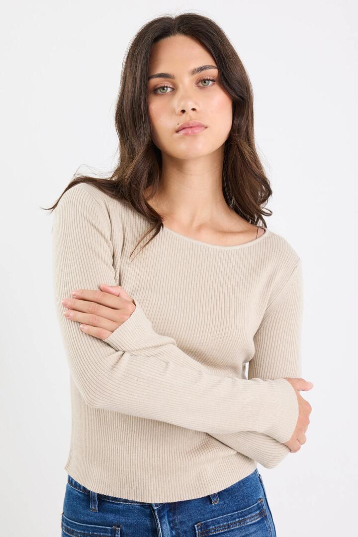 Image of a model wearing Outerwear. Product name - Reciprocal Champagne Boatneck LS Rib Top in Champagne colour by brand - Ivy + Jack