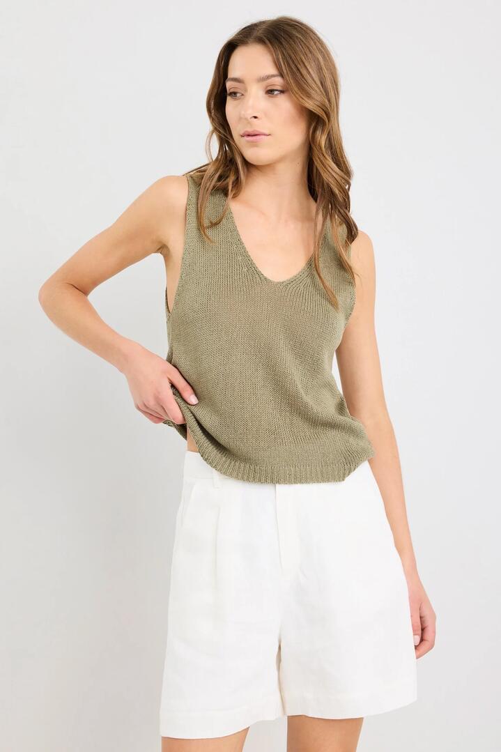 Image of a model wearing Shorts. Product name - Literal Ivory Linen Pleat Front Shorts in Ivory Linen colour by brand - Stories be Told