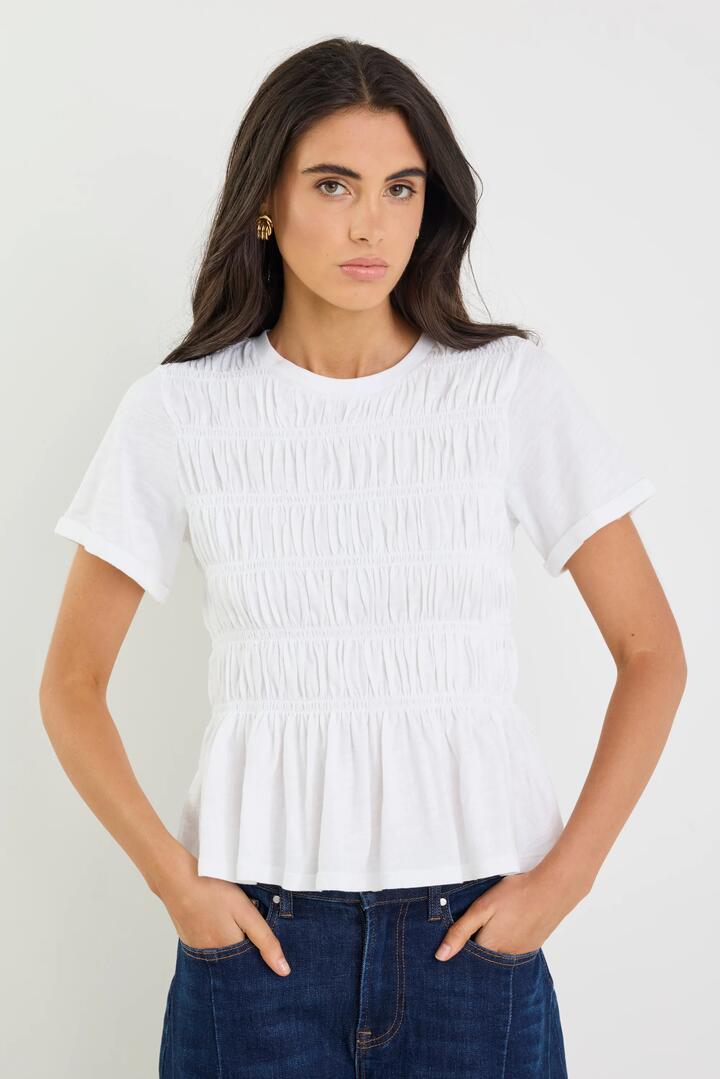 Image of a model wearing Tops. Product name - Neat White Slub Shirred Detail SS Tee in White colour by brand - Stories be Told