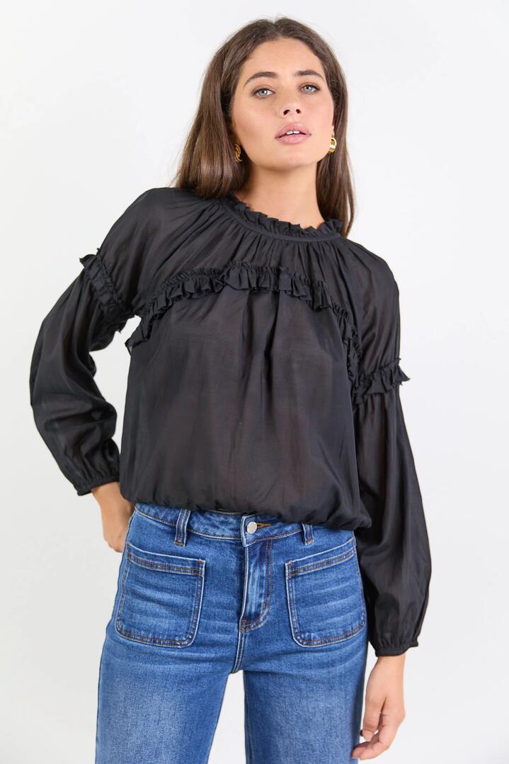 Image of a model wearing Tops. Product name - Manifest Black Voile Frill Detail LS Top in Black colour by brand - Among the Brave