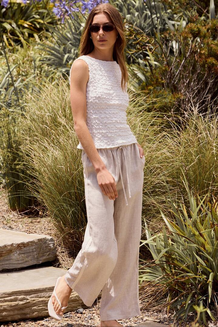 Image of a model wearing Pants. Product name - Townie Natural Linen Side Stripe Elastic Waist Pants in Natural Linen colour by brand - Stories be Told