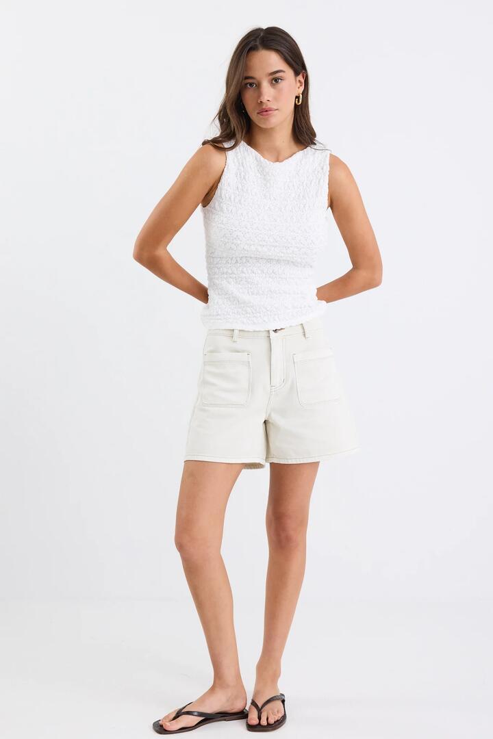 Image of a model wearing Shorts. Product name - Significant Ecru Denim Pocket Front Shorts in Ecru Denim colour by brand - Stories be Told