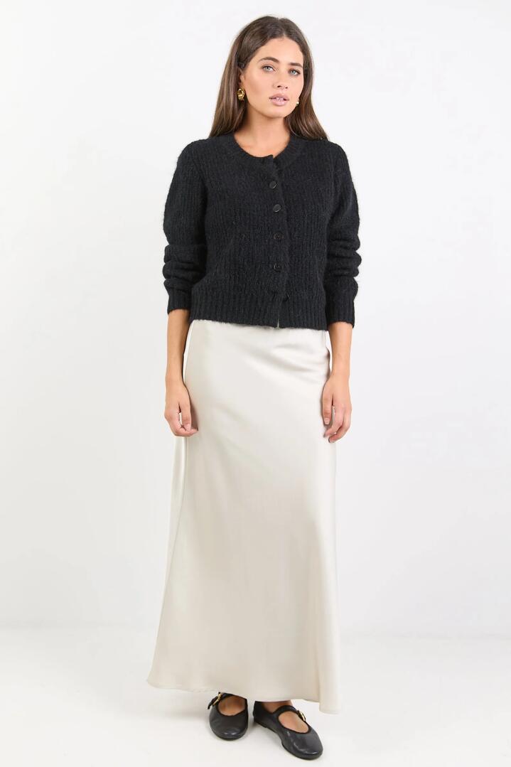 Image of a model wearing Skirts. Product name - Prodigy Pearl Satin Bias Maxi Skirt in Pearl colour by brand - Stories be Told