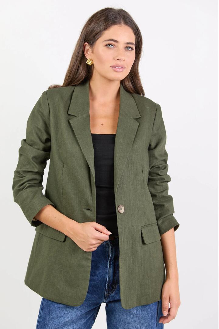 Image of a model wearing Outerwear. Product name - Dock Khaki Ramie Rolled Sleeve Blazer in Khaki colour by brand - Ivy + Jack