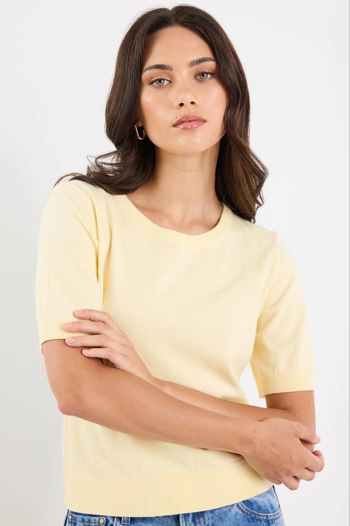 Image of a model wearing Outerwear. Product name - Edition Lemon Crewneck Cashmere Blend Knit Tee in Lemon colour by brand - Stories be Told