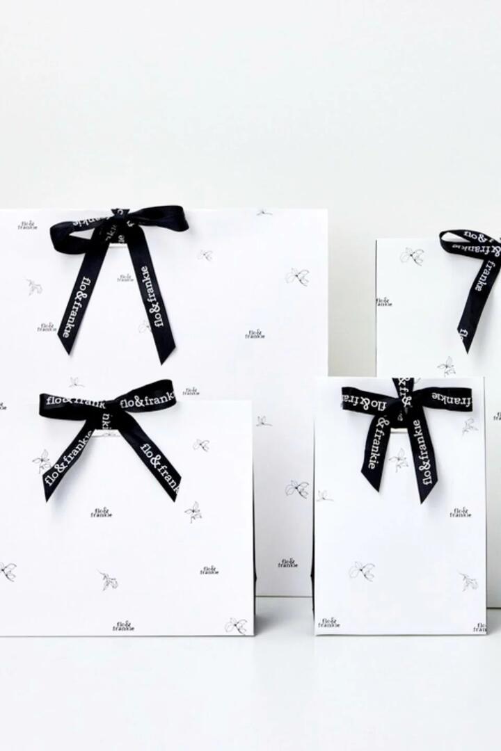 Image of Scarves & Shawls. Product name - Gift Wrap That Gives Back in colour by brand - Floandfrankie