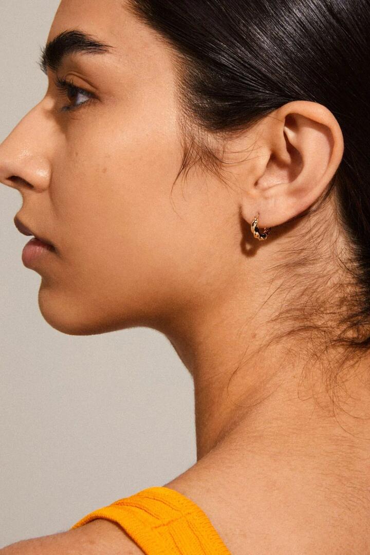 Image of Jewelry. Product name - Taffy Recycled Small Swirl Hoop Earrings Gold in Gold colour by brand - Pilgrim