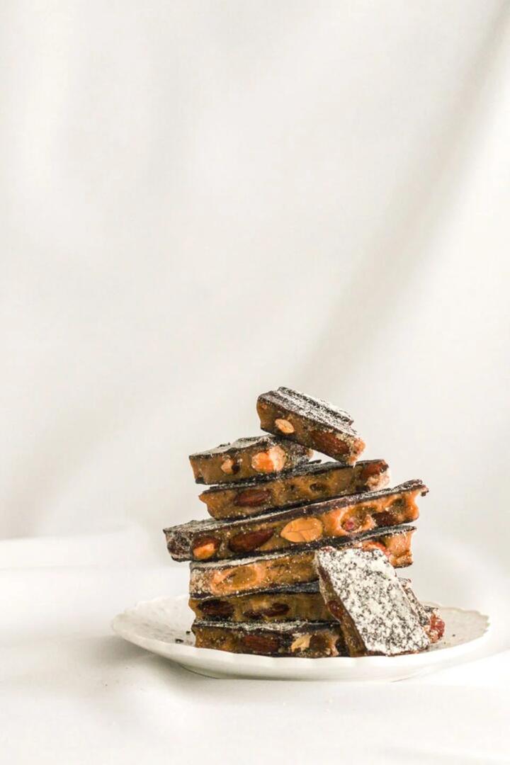 Image of Food Items. Product name - Dark Chocolate + Almond Toffee 85g Jar in colour by brand - The Confectionist