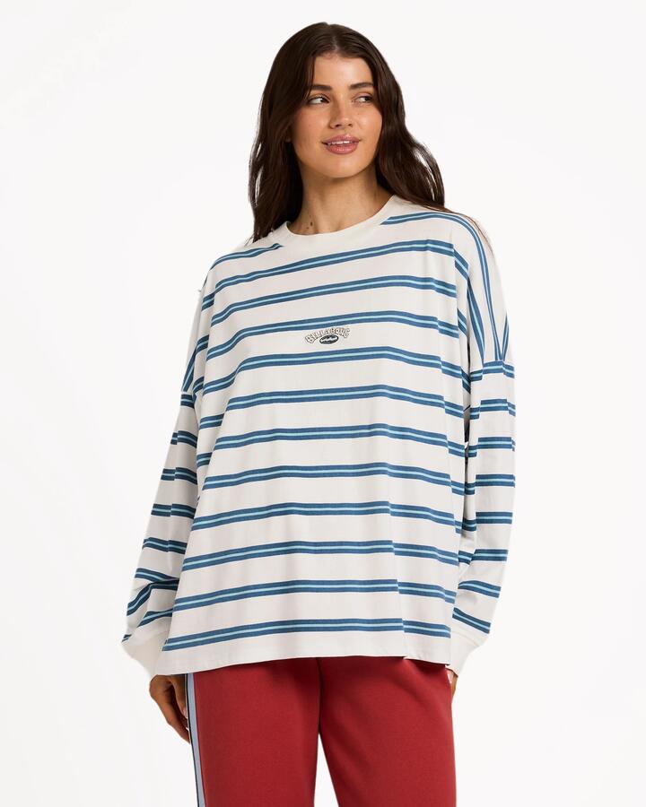 Image of a model wearing Tops. Product name - Billabong Womens Original Tides Long Sleeve T-Shirt Salt Crystal in Salt Crystal colour by brand - Billabong