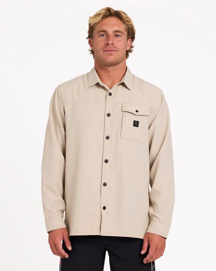 Image of a model wearing Tops. Product name - Billabong Mens Strike Mission Traveller Long Sleeve Shirt Bone in Bone colour by brand - Billabong