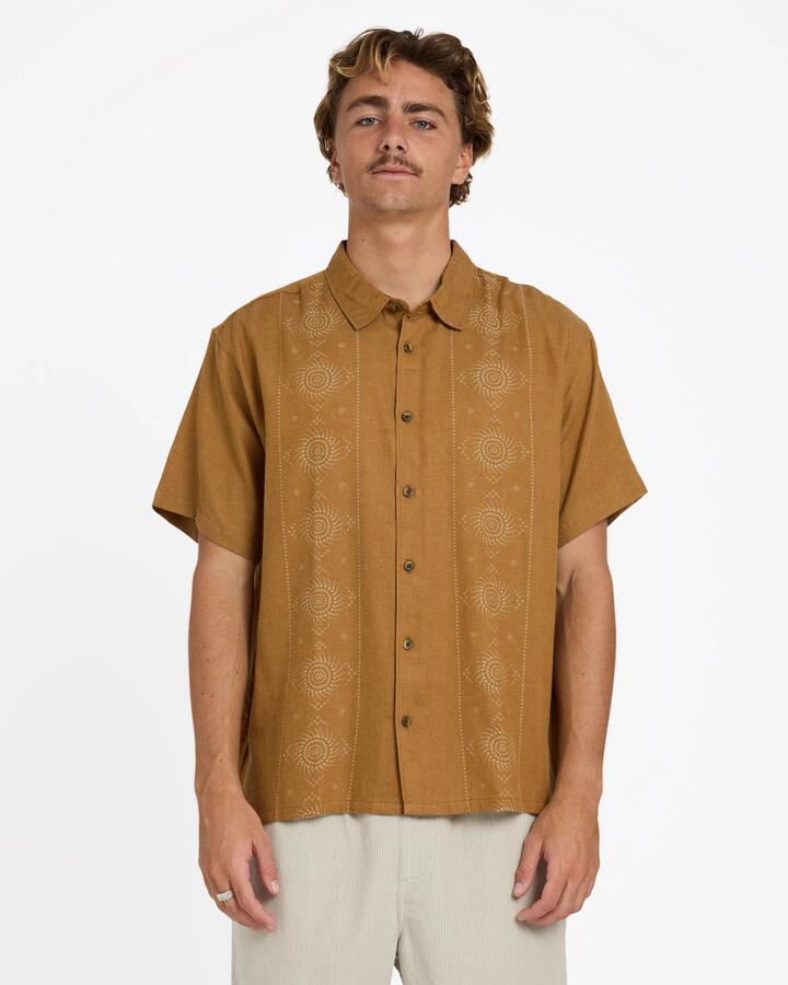 Image of a model wearing Tops. Product name - Billabong Mens Cordoba Short Sleeve Shirt Rubber in Rubber colour by brand - Billabong