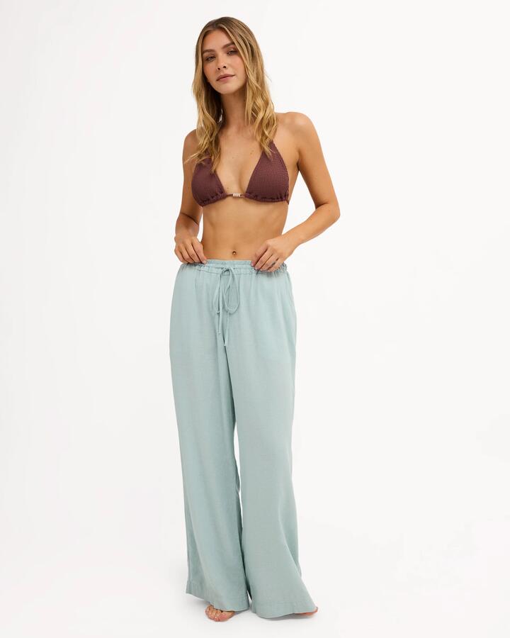 Image of a model wearing Pants. Product name - Billabong Womens Calais Pants Cover Up Blue Light in Blue Light colour by brand - Billabong