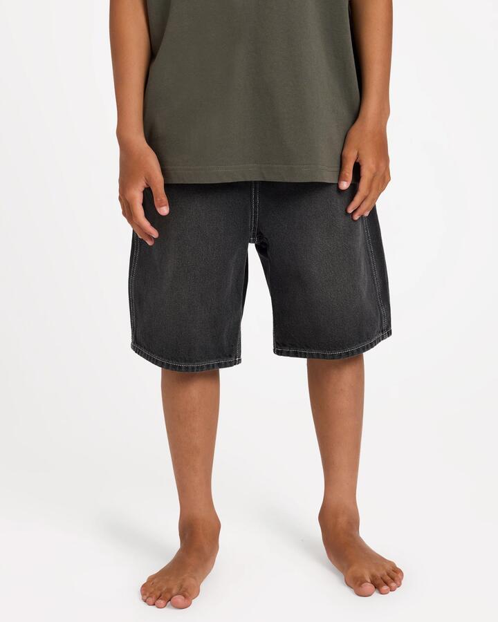 Image of a model wearing Shorts. Product name - Billabong Boys 8-16 Boys Spec Denim Shorts Black in Black colour by brand - Billabong