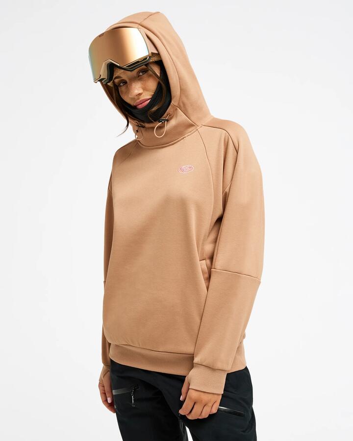 Image of a model wearing Outerwear. Product name - Roxy Womens Liberty Hoodie Technical Fleece Cafe Au Lait in Cafe Au Lait colour by brand - Roxy