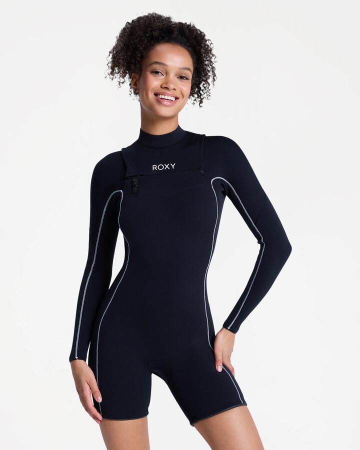 Image of a model wearing Tops. Product name - Roxy Womens 2Mm Elite Xtra Stretch Fullzip Long Sleeve Springsuit Black in Black colour by brand - Roxy