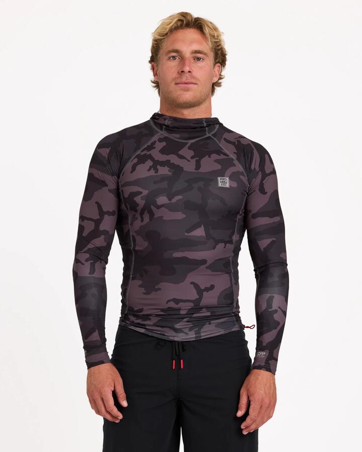 Image of a model wearing Tops. Product name - Billabong Mens Strike Mission Hooded Long Sleeve Rash Vest Black Camo in Black Camo colour by brand - Billabong