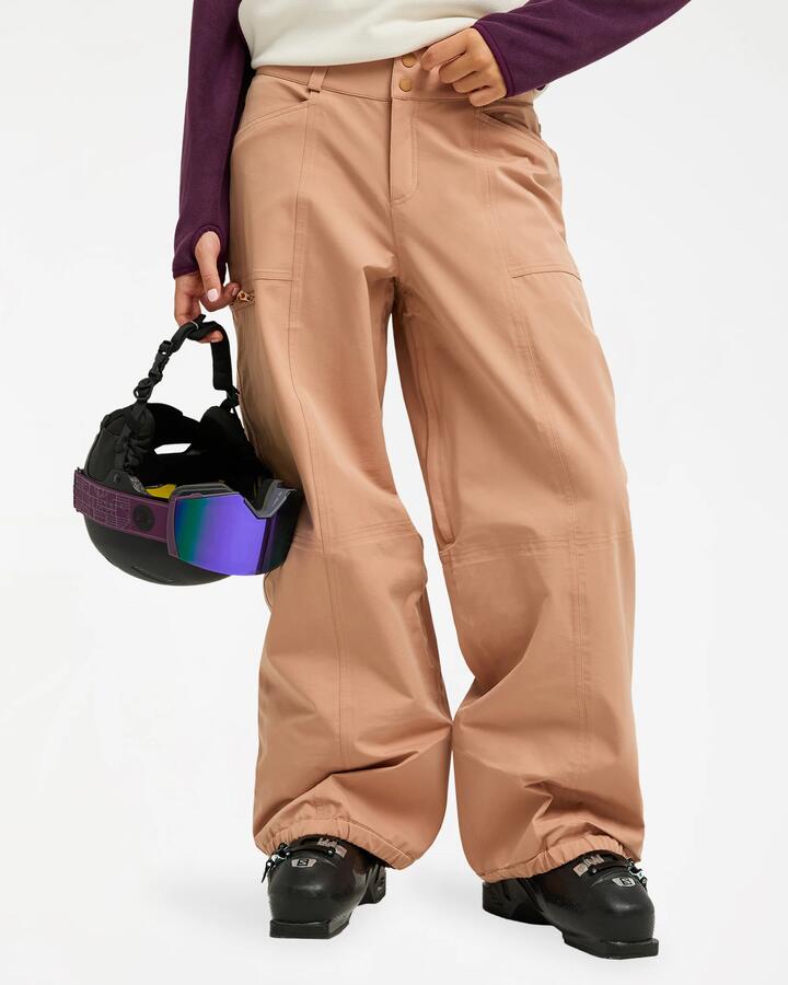 Image of a model wearing Pants. Product name - Roxy Women 20K Airdrift Snow Pants Cafe Au Lait in Cafe Au Lait colour by brand - Roxy