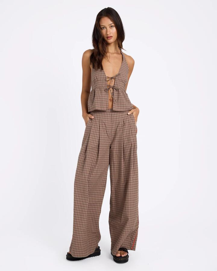 Image of a model wearing Pants. Product name - Volcom Womens Checker Pants Earth in Earth colour by brand - Volcom