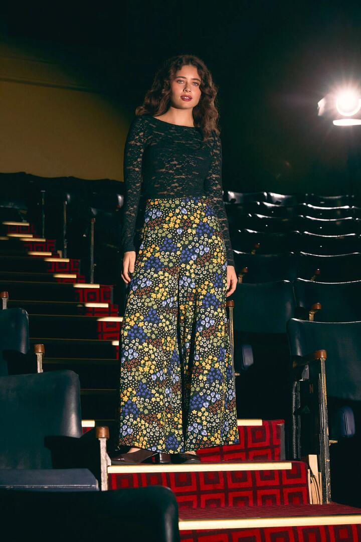 Image of a model wearing Pants. Productname: Iris Ditsy Palazzo Pant in Blue colour by brand - Princess Highway