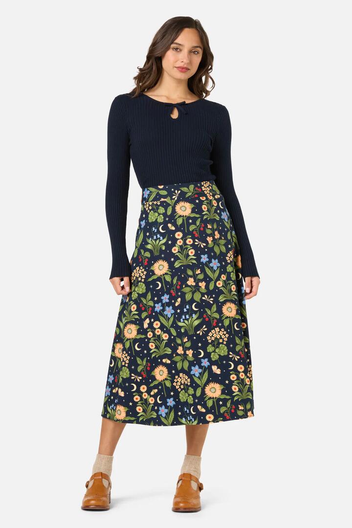 Image of a model wearing Skirts. Productname: Midnight Garden Midi Skirt in Navy colour by brand - Princess Highway