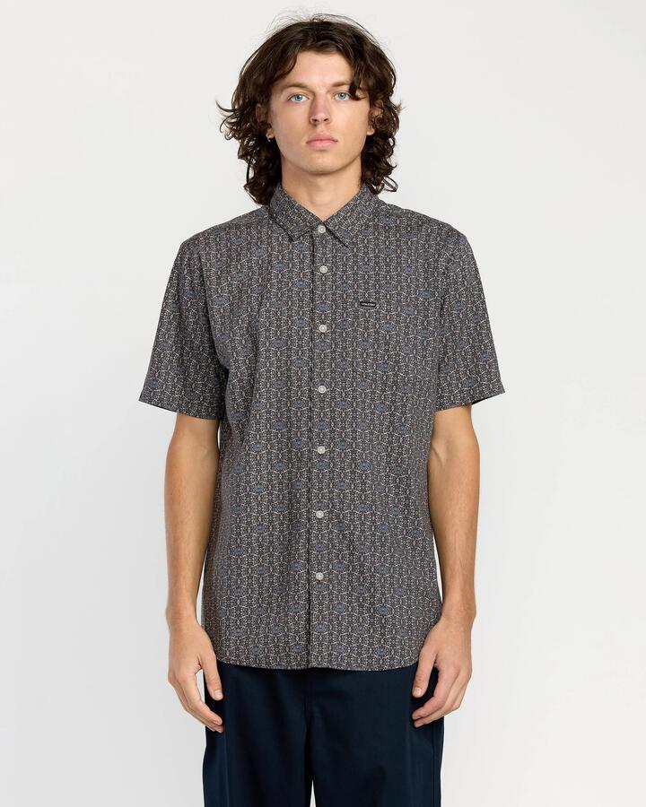 Image of a model wearing Tops. Product name - Volcom Mens Scaller Stone Woves Short Sleeve Shirt Moonbeam in Moonbeam colour by brand - Volcom