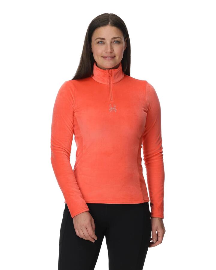 Image of a model wearing Outerwear. Product name - Spyder Womens Shimmer Bug 1/2 Zip Jumper Coral Haze in Coral Haze colour by brand - Spyder