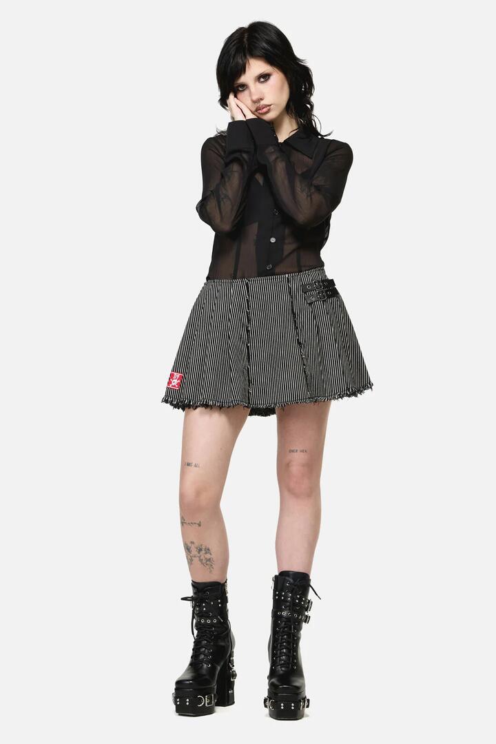 Image of a model wearing Skirts. Productname: Medusa Punk Skort in Black colour by brand - Dangerfield