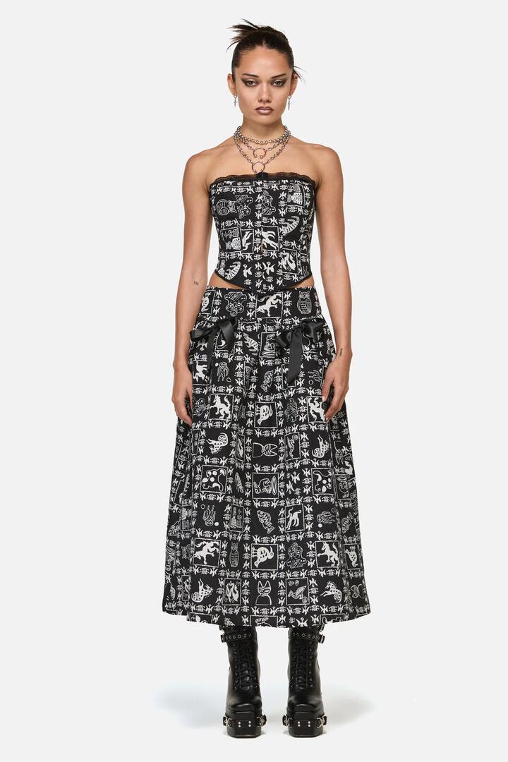 Image of a model wearing Skirts. Product name - Manuscript Goth Skirt in Black colour by brand - Black Friday