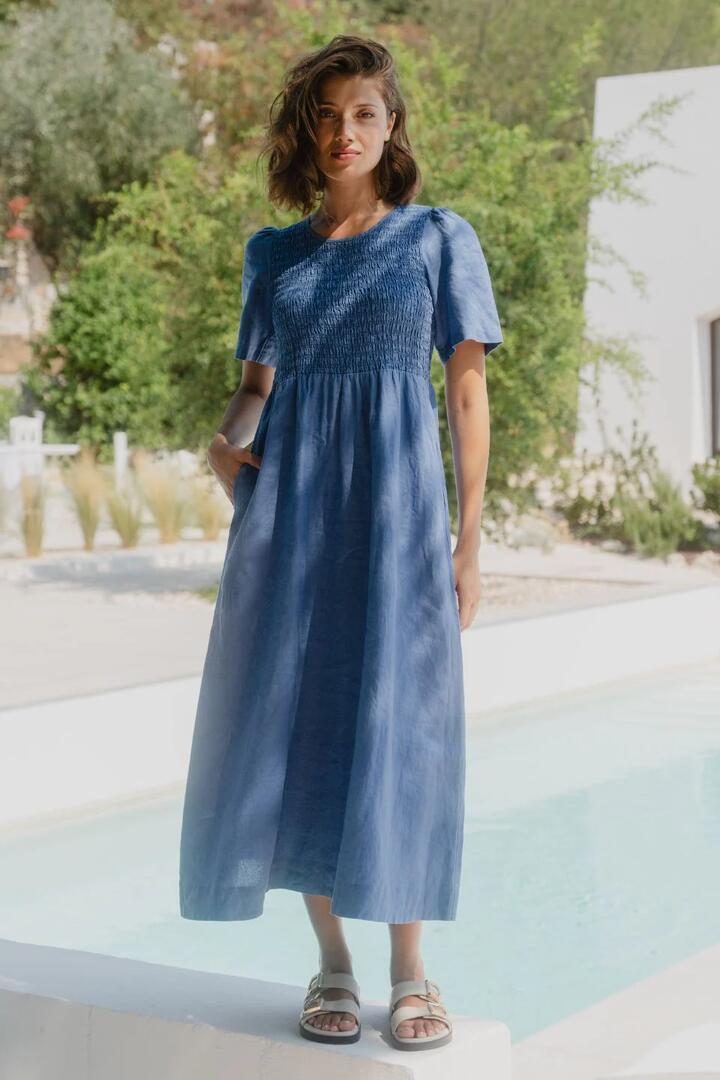 Image of Dresses. Product name - Wren Cornflower Blue Linen SS Shirred Bodice Midi Dress in Cornflower Blue colour by brand - RE:UNION Label