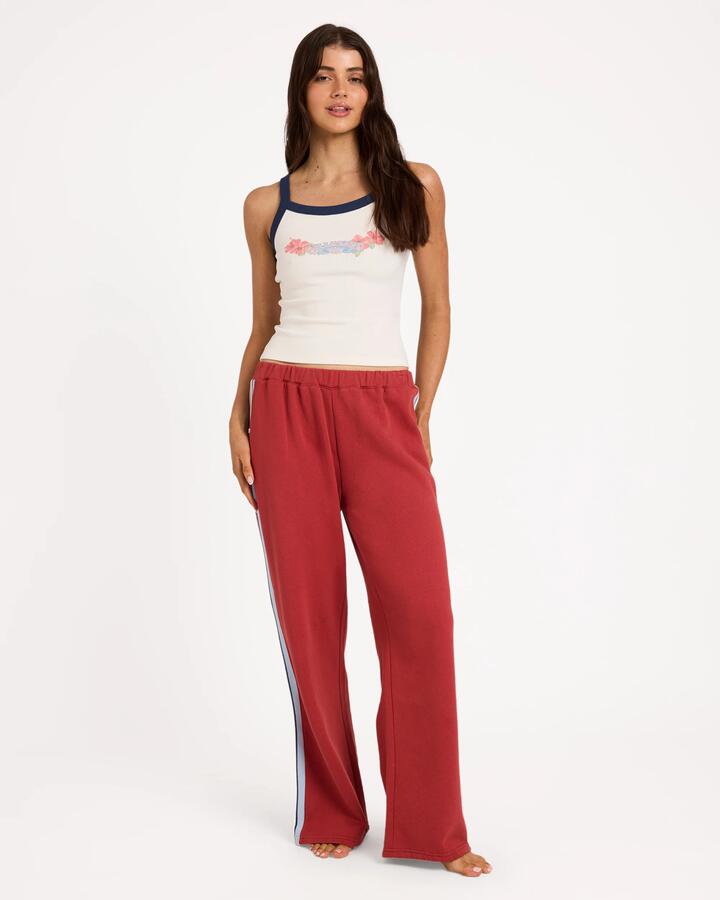 Image of a model wearing Pants. Product name - Billabong Womens Culture Trackpants Red Crush in Red Crush colour by brand - Billabong