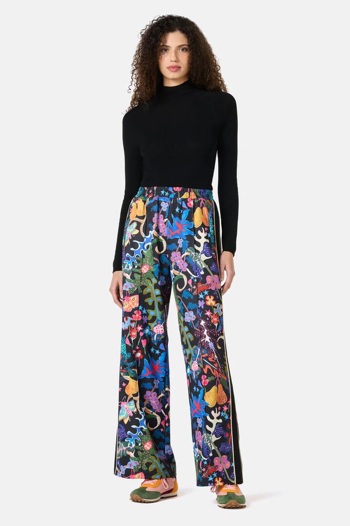 Image of a model wearing Pants. Product name - Beetlemania Track Pant in Print colour by brand - Gorman