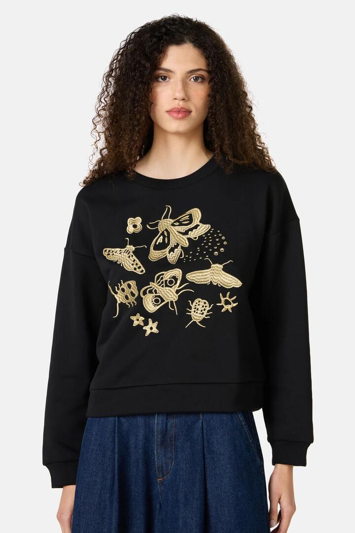 Image of a model wearing Outerwear. Product name - Beetlemania Organic Sweater in Black colour by brand - Gorman