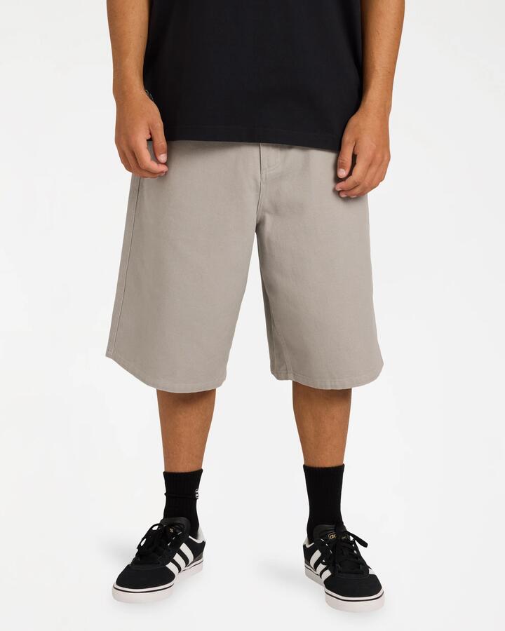 Image of a model wearing Shorts. Product name - Billabong Mens Spec Bio Twill Walkshorts Ash in Ash colour by brand - Billabong