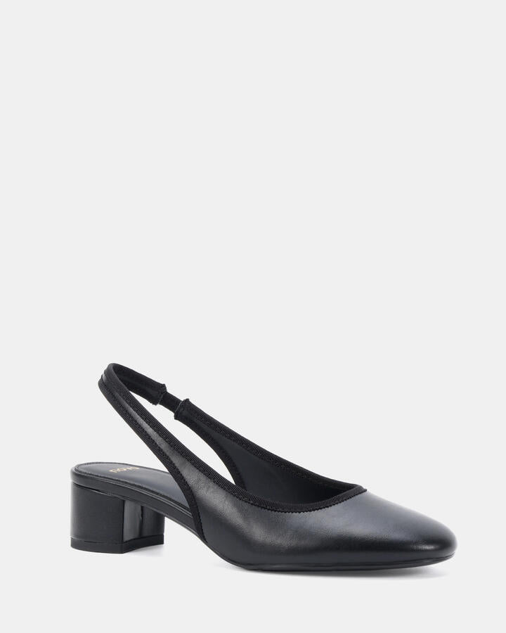 Image of a model wearing Pants. Product name - Intro Black Pumps in Black colour by brand - Novo