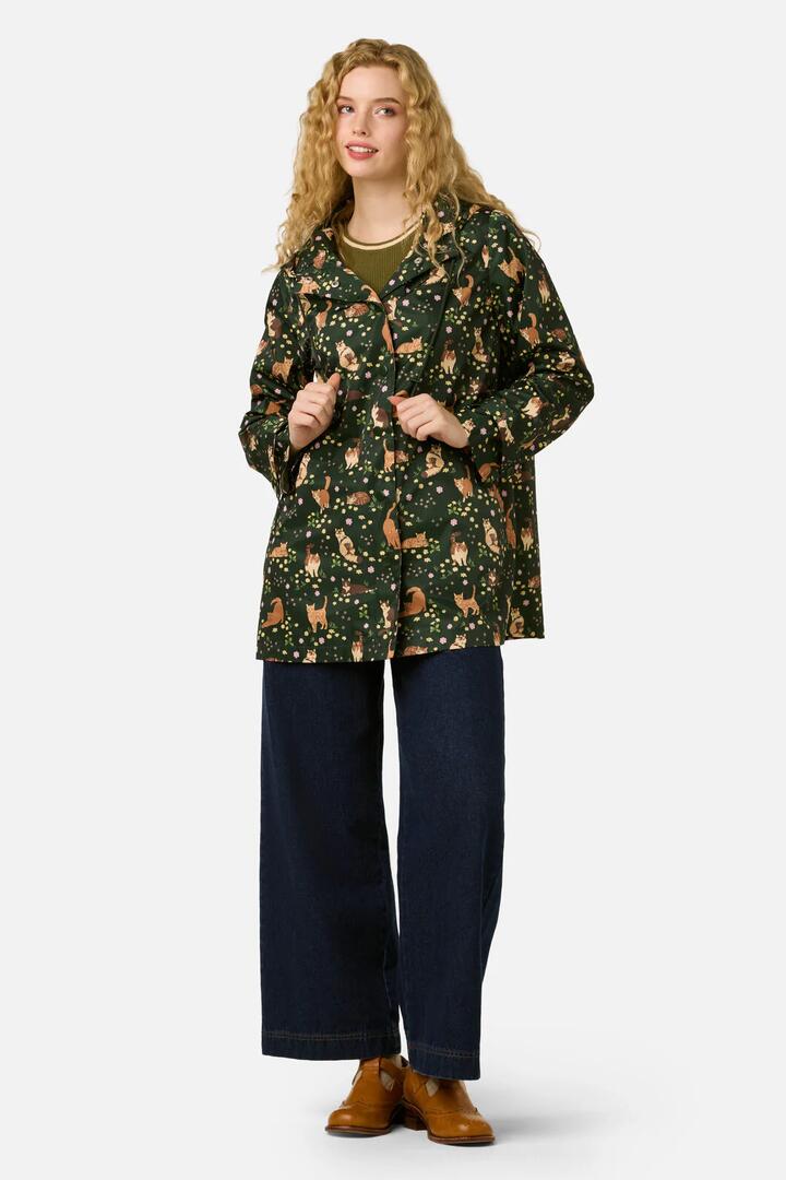 Image of a model wearing Rain Coats. Productname: Cute Cats Raincoat in Green colour by brand - Princess Highway