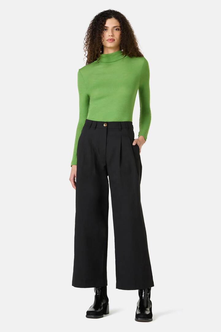 Image of a model wearing Pants. Product name - Raven Pant in Black colour by brand - Gorman