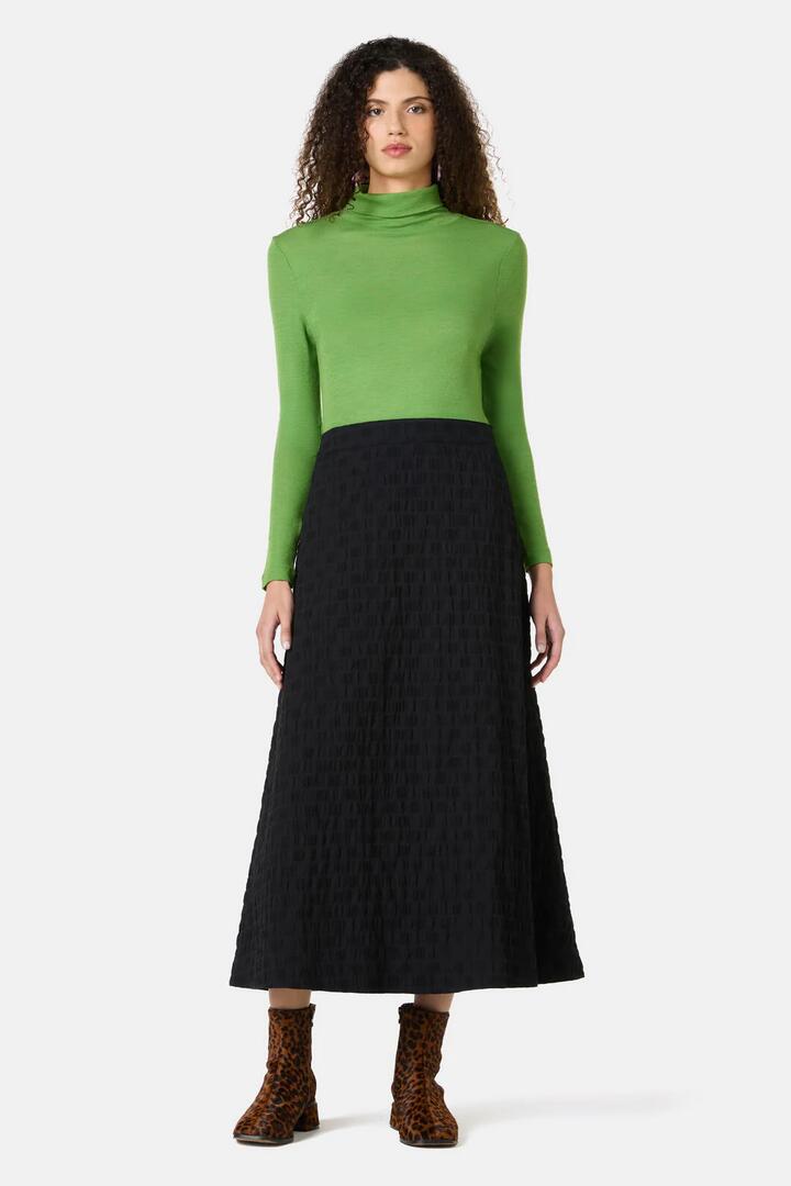 Image of a model wearing Skirts. Product name - Clover Seersucker Midi Skirt in Black colour by brand - Gorman