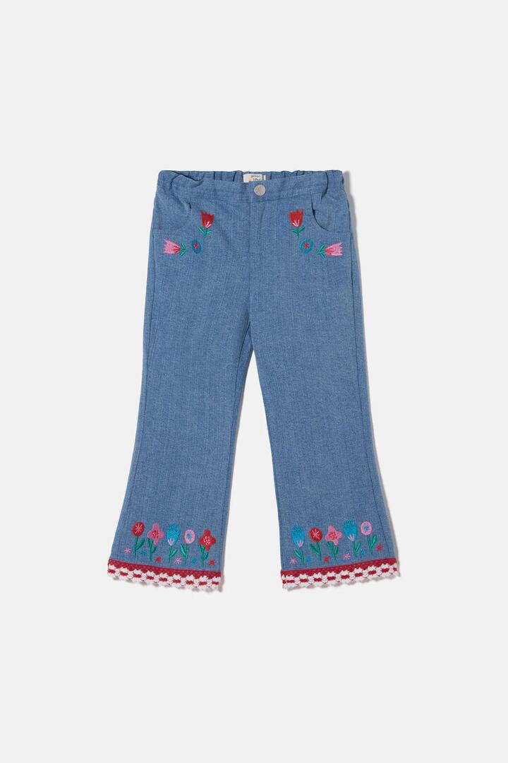 Image of a model wearing Pants. Product name - Embroidery Flowers Kids Pants in Denim colour by brand - Gorman