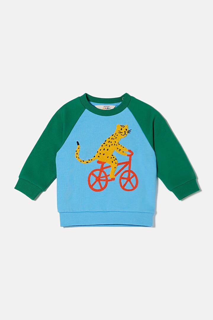 Image of a model wearing Outerwear. Product name - Leo On Bike Baby Sweater in Multi colour by brand - Gorman