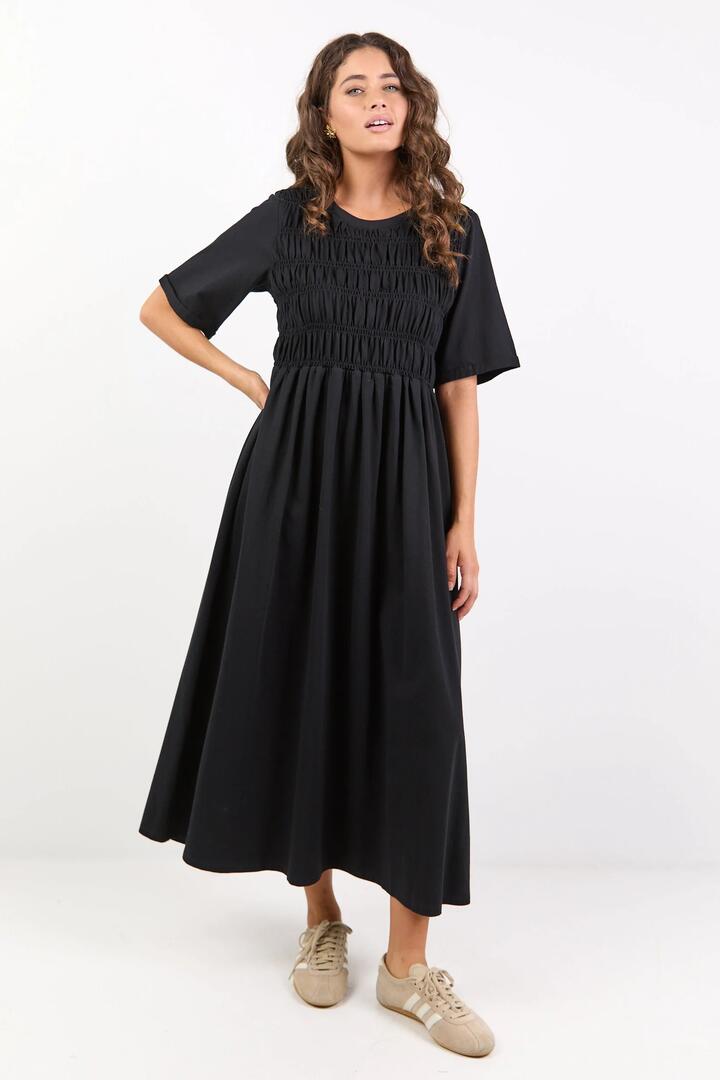 Image of Dresses. Product name - Ripple Black Shirred Bodice Short Sleeve Knit Midi Dress in Black colour by brand - Stories be Told