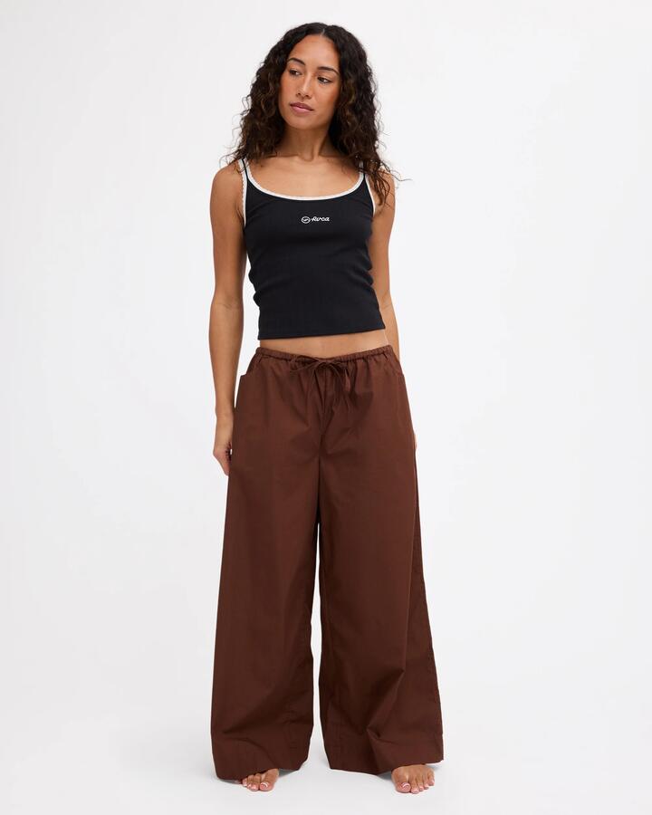 Image of a model wearing Pants. Product name - Rvca Womens Montana Woven Pants Chocolate in Chocolate colour by brand - Rvca