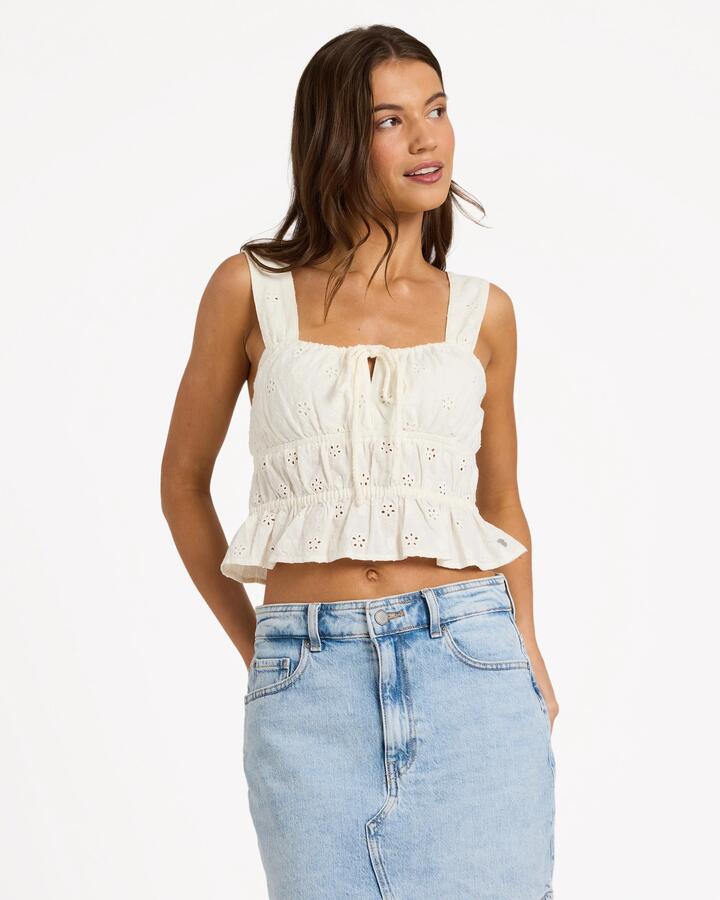 Image of a model wearing Tops. Product name - Roxy Womens Lucky One Sunset Mist Tank Top Coconut Milk in Coconut Milk colour by brand - Roxy