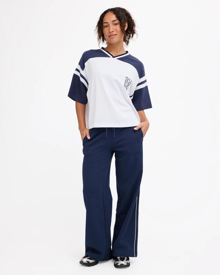Image of a model wearing Pants. Product name - Rvca Womens Rvca Trackpants Navy in Navy colour by brand - Rvca