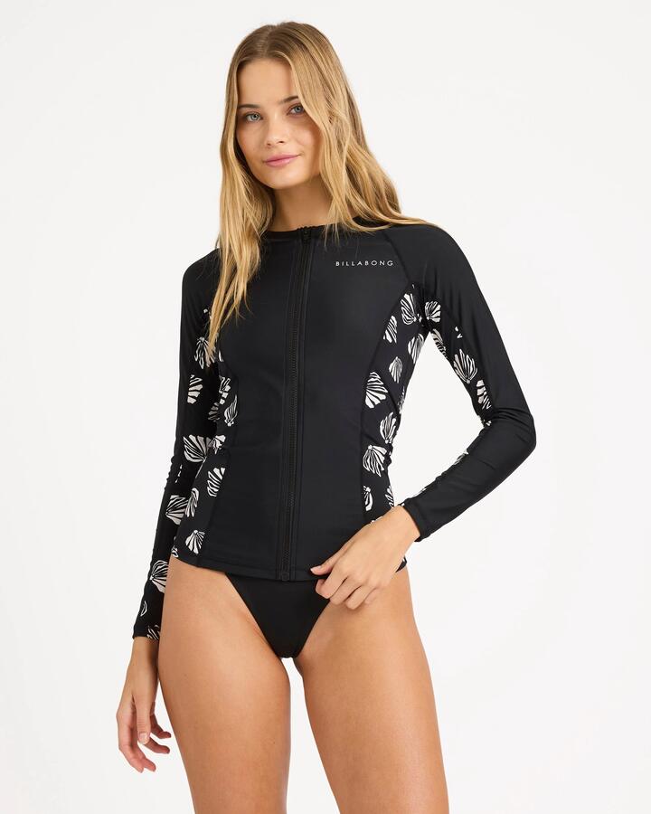 Image of a model wearing Tops. Product name - Billabong Womens Sandy Shells Off Shore Long Sleeve Rash Vest Black in Black colour by brand - Billabong