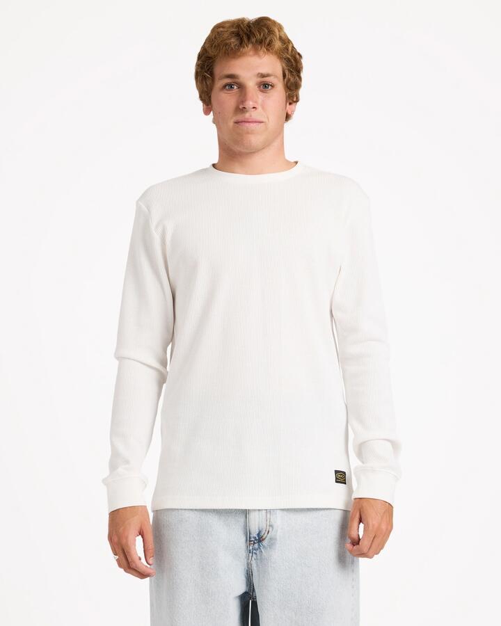 Image of a model wearing Tops. Product name - Rvca Mens Dayshift Thermal Long Sleeve T-Shirt Antique White in Antique White colour by brand - Rvca