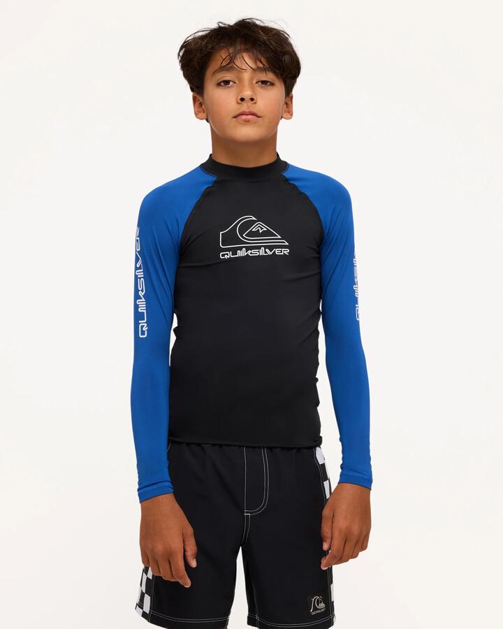 Image of a model wearing Tops. Product name - Quiksilver Boys 8-16 On Tour Long Sleeve Rash Vest Monaco Blue in Monaco Blue colour by brand - Quiksilver